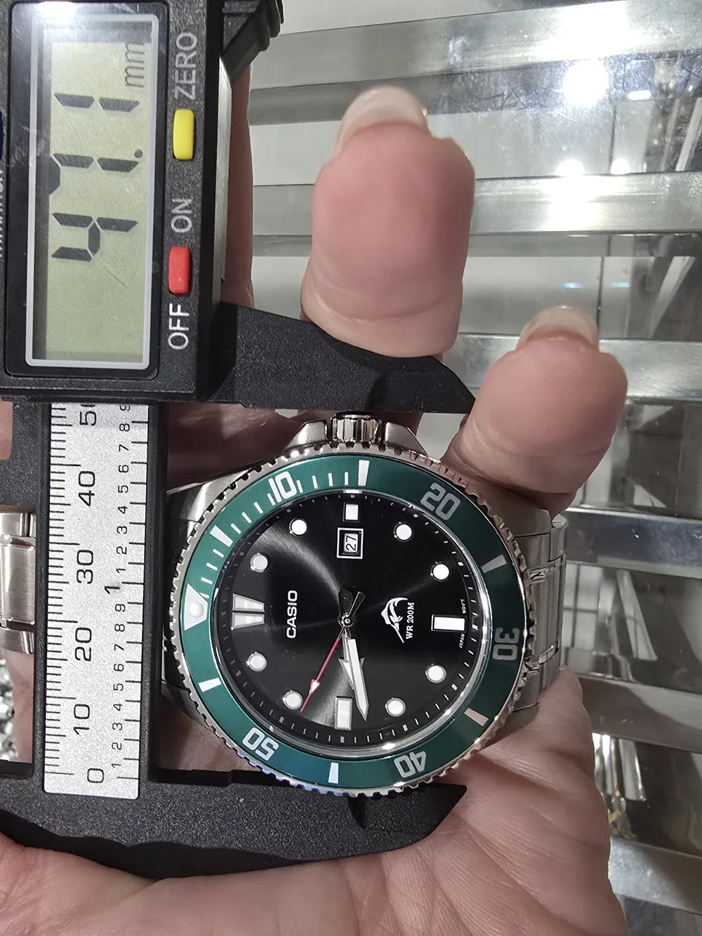 Casio Men's Stainless Steel Watch with Green Bezel
